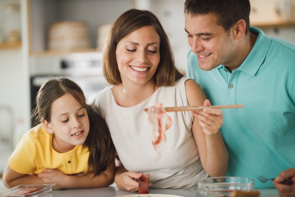 Family cooking together in the kitchen